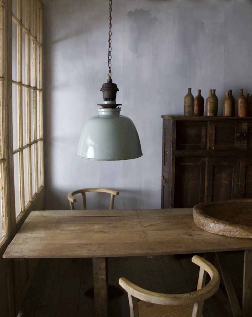 A set of three large enamelled pendant lights