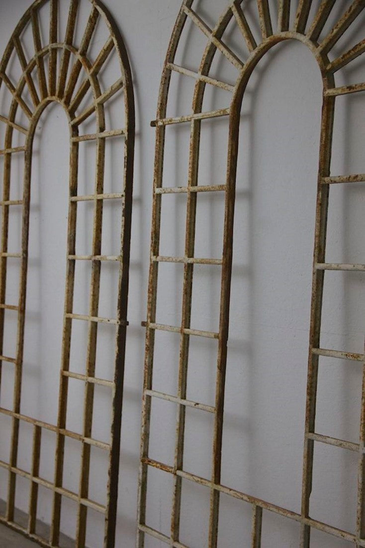 A large pair of C19th arched iron frames
