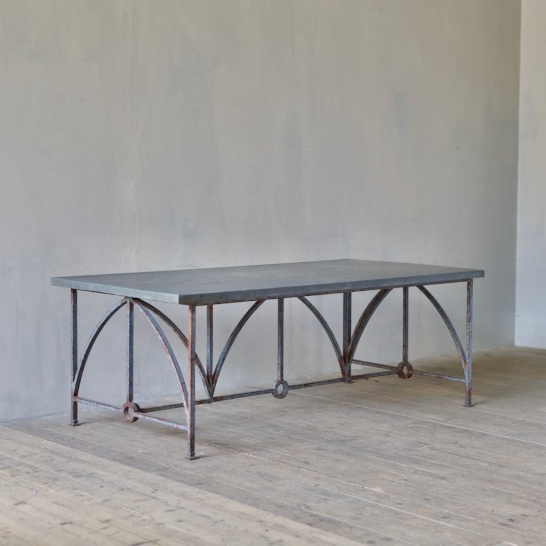 An architectural iron and zinc dining table