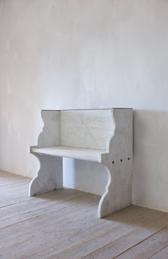 A Carrara marble bench