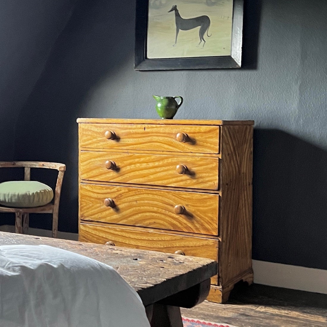 A faux elm painted chest of drawers