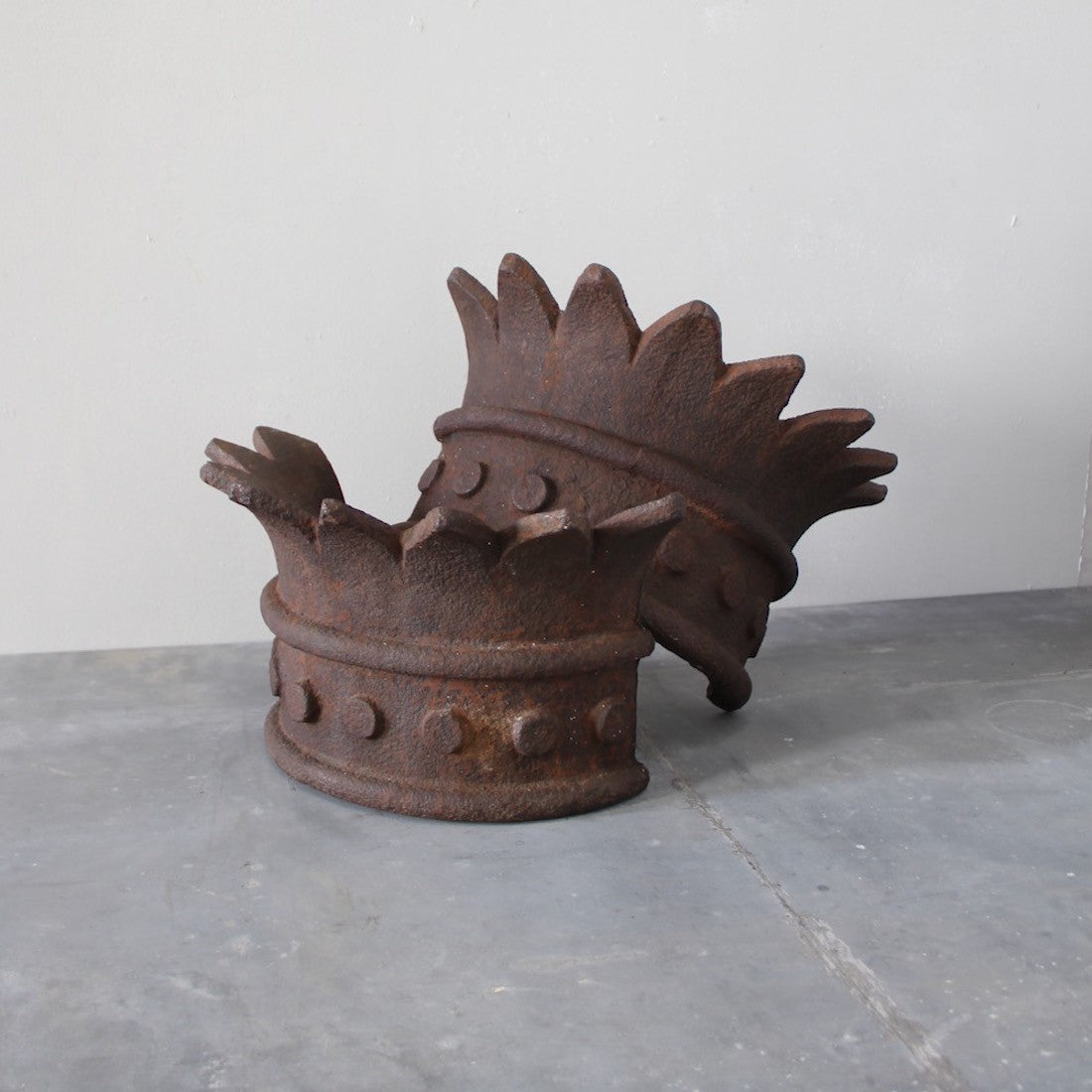 A pair of crown wall lights