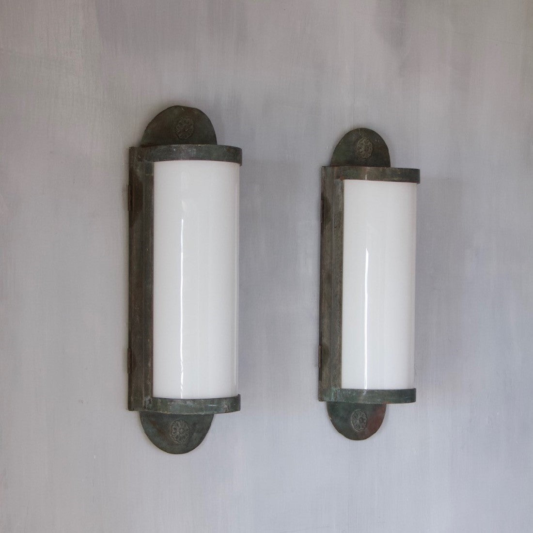 A pair of large bronze wall lanterns