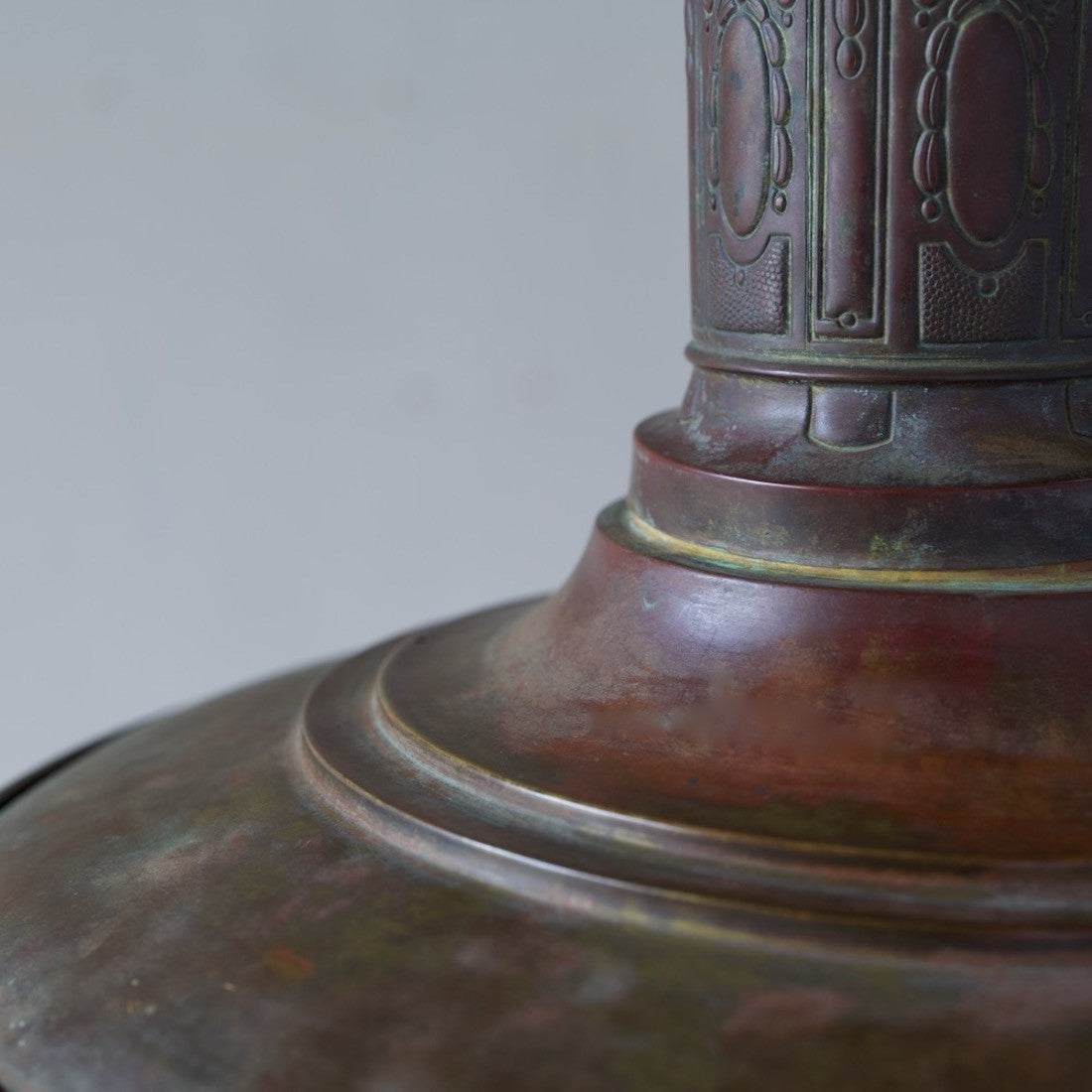 A rare copper station light with quilted glass shade