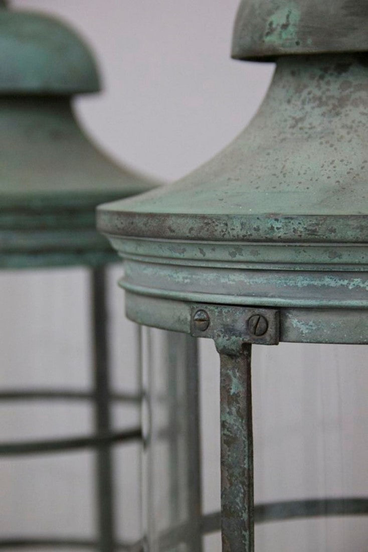 A pair of bronze 1920s lanterns
