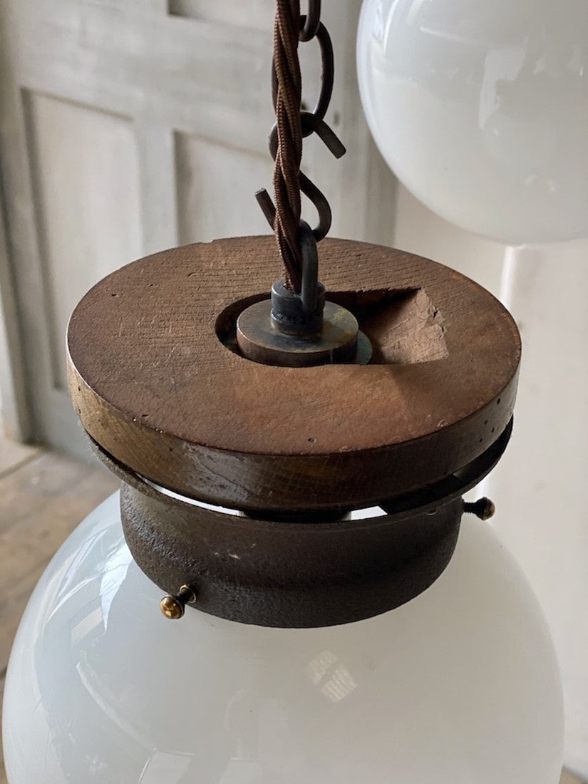 A pair of globe pendant lights