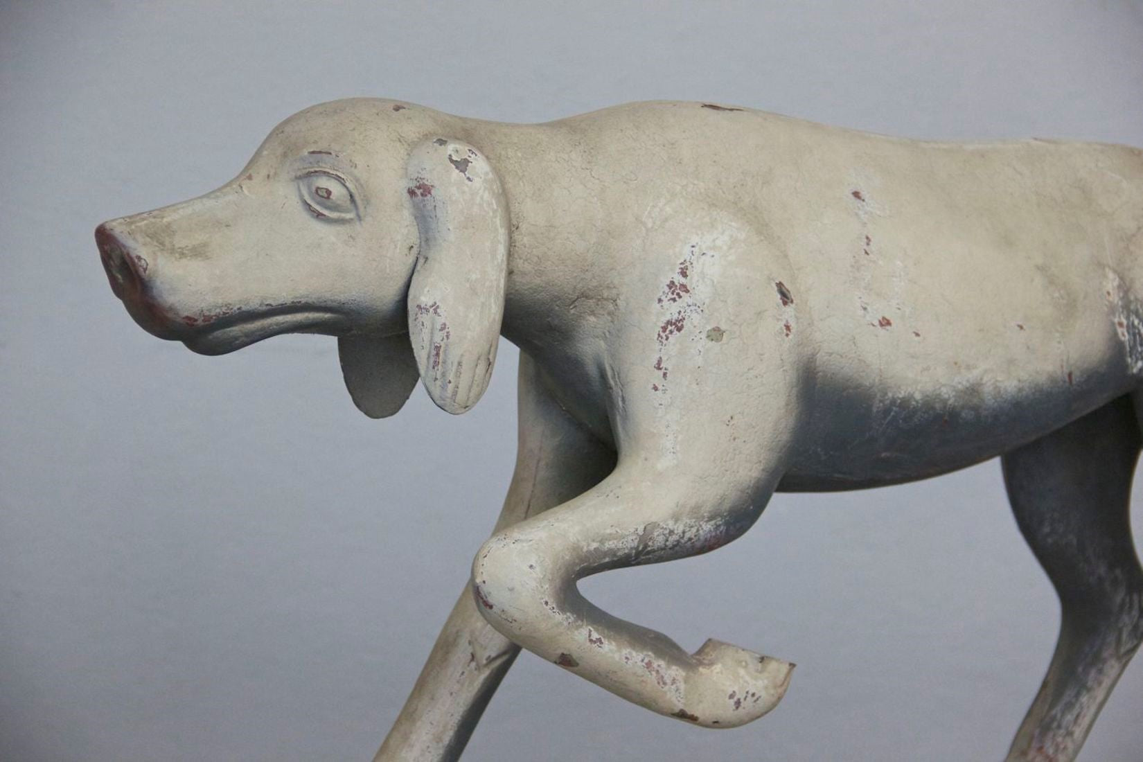 A primitive tin hunting dog
