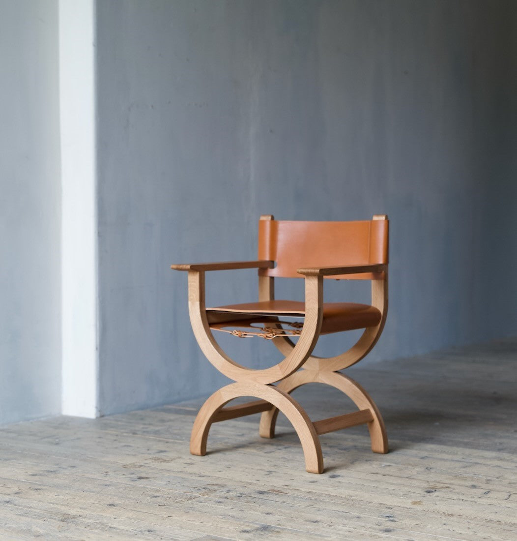 A set of bespoke x-frame chairs