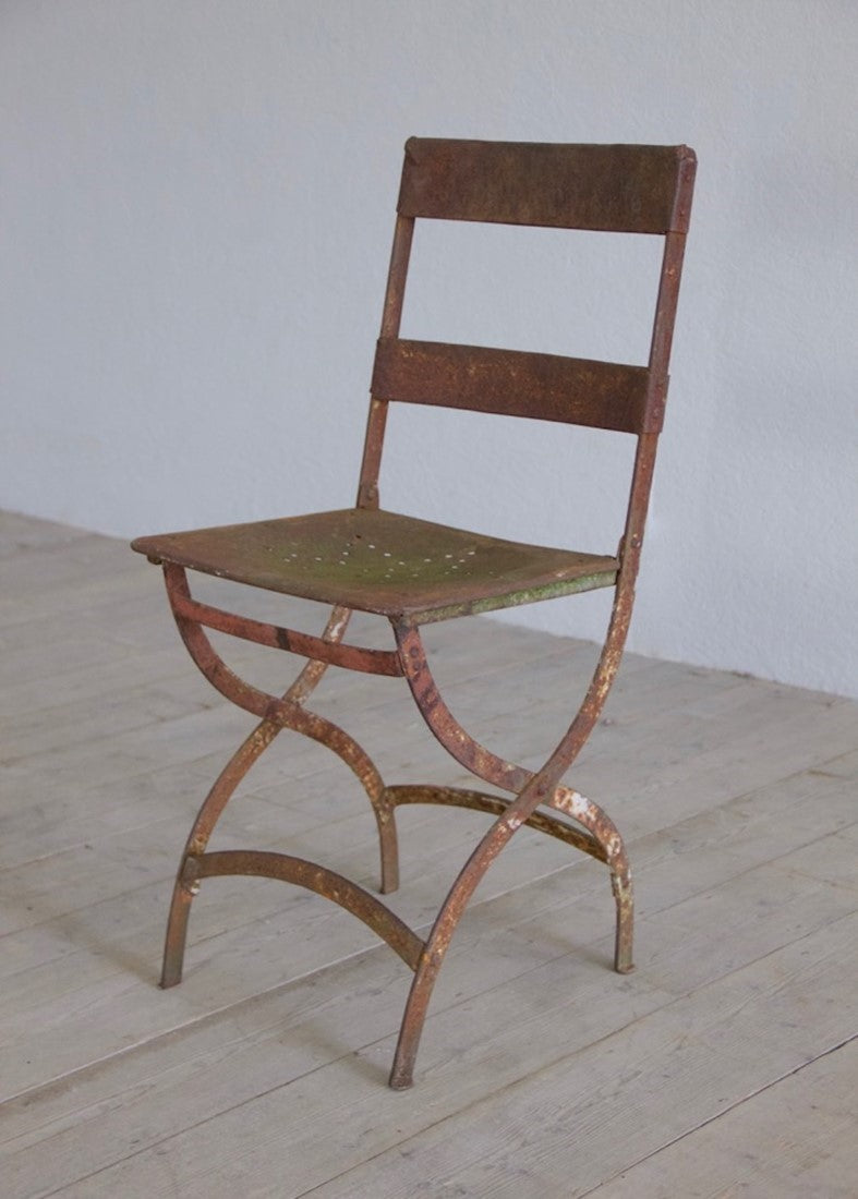 A set of six iron chairs
