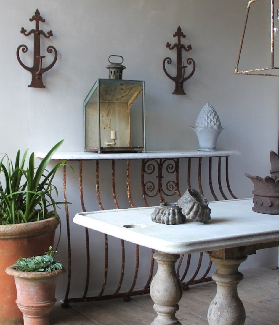 A pair of wrought iron sconces