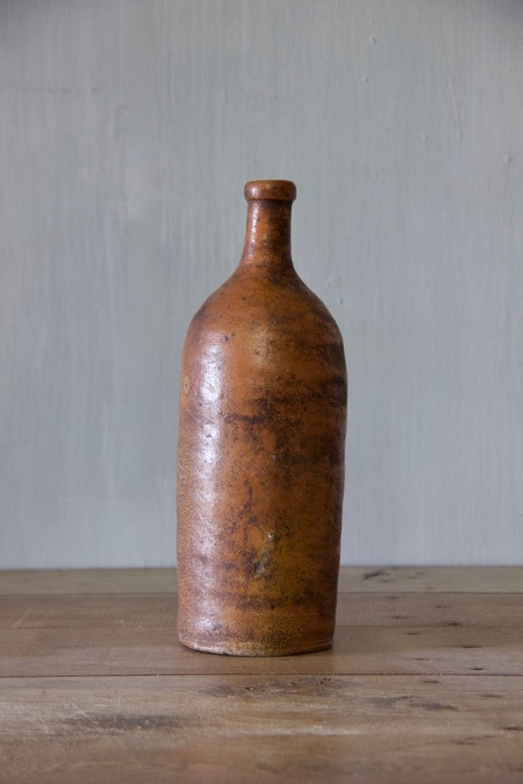 A set of ten clay bottles
