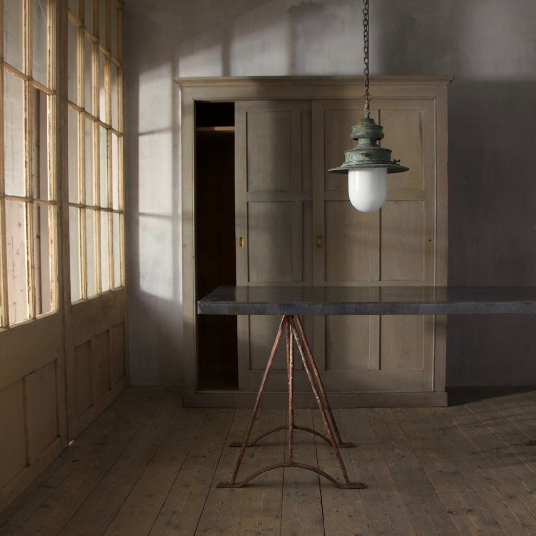 A verdigris copper station light