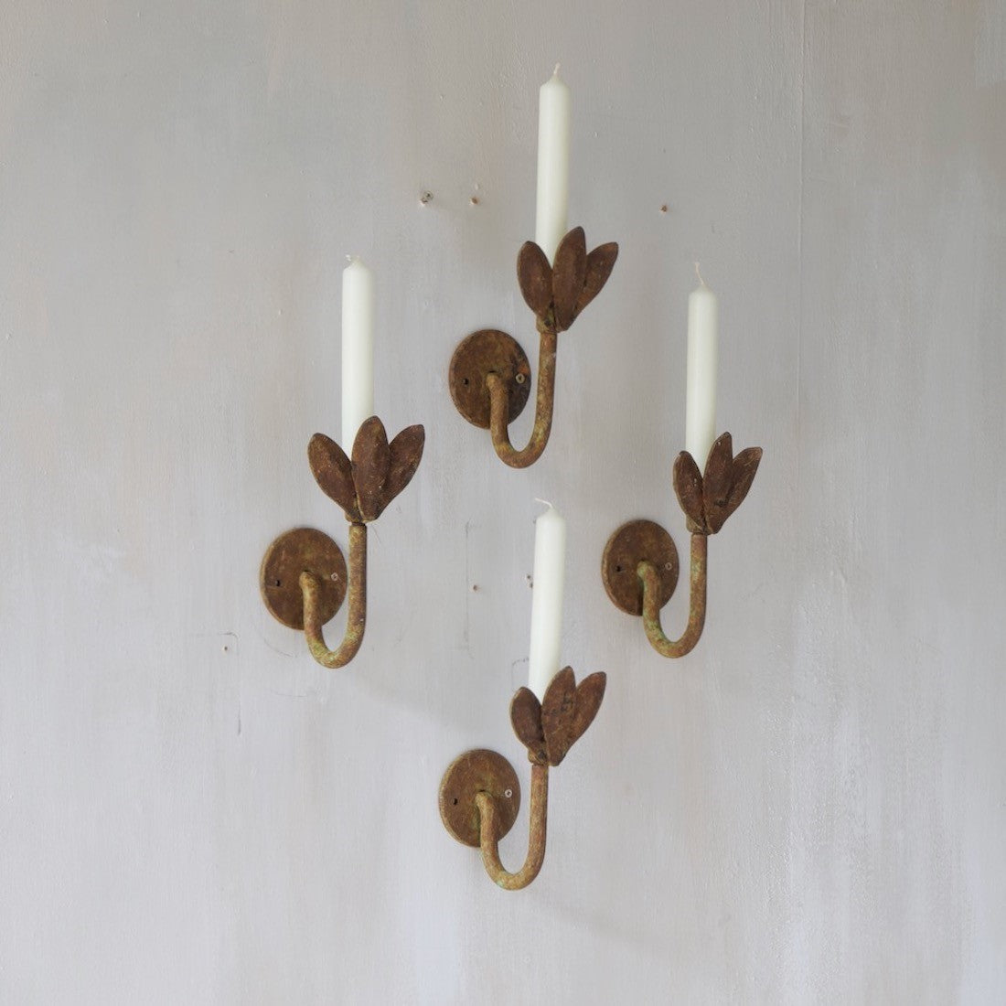 A set of four petal sconces