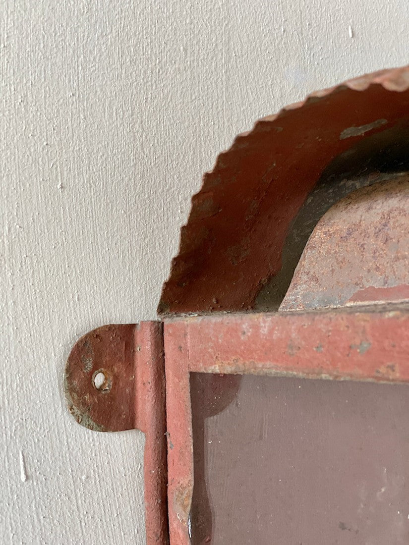A primitive tole wall lantern