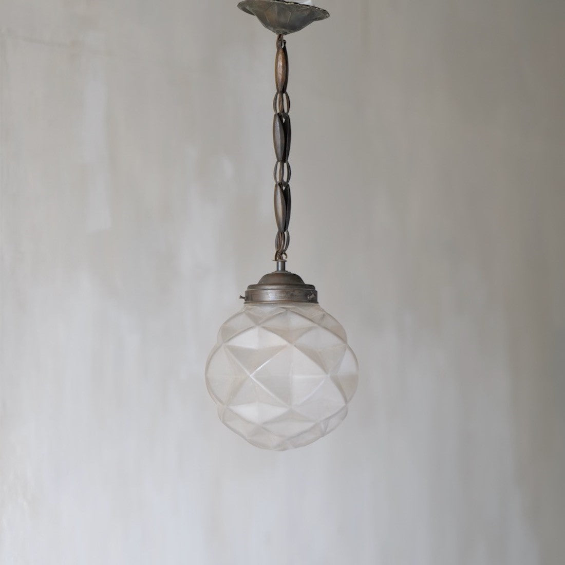 A geometric globe pendant light
