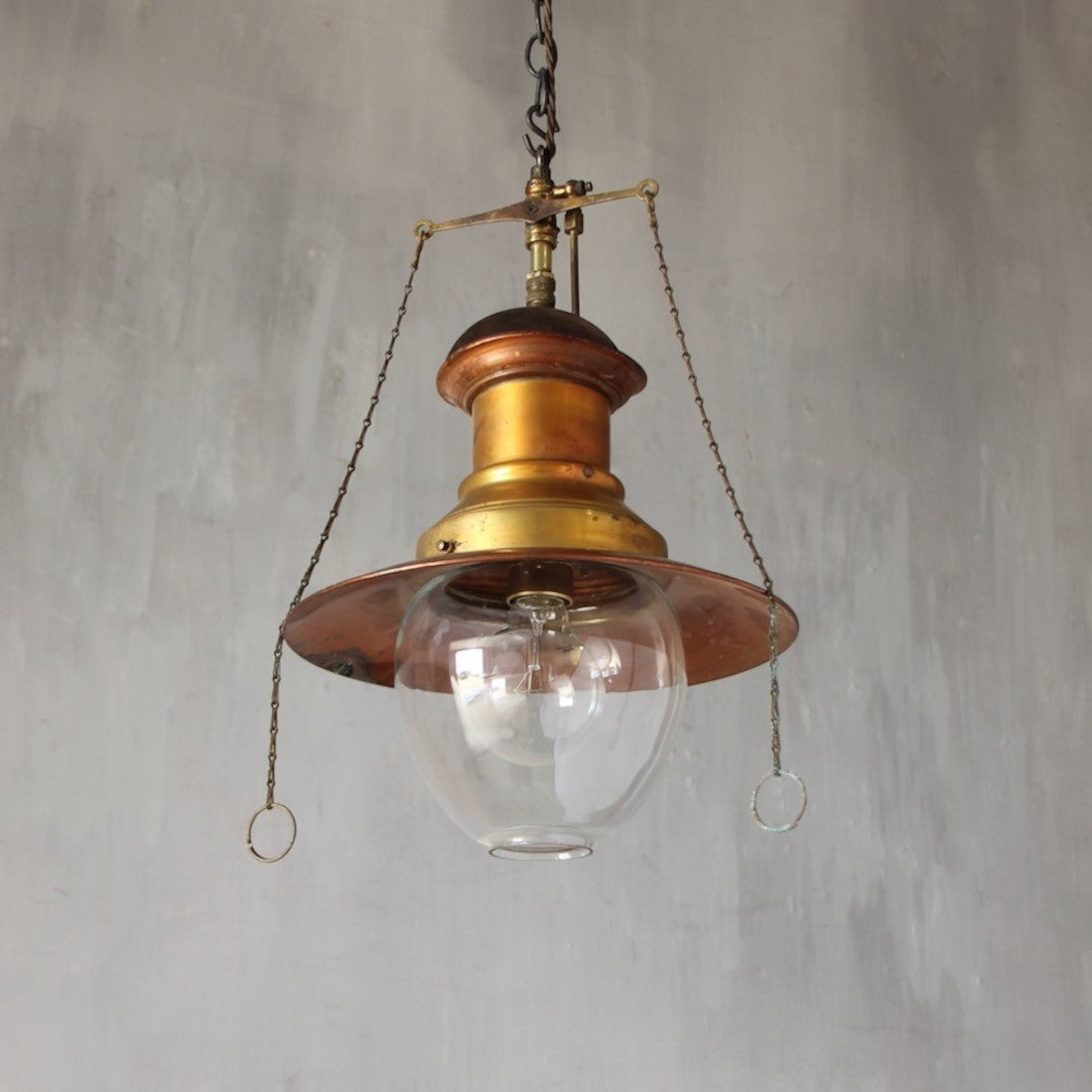 A set of three original gas pendant lights