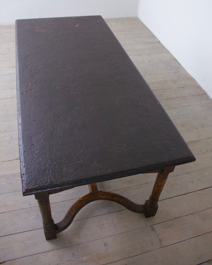 A heavily patinated oak table