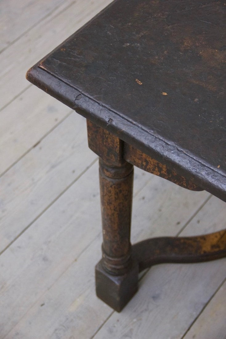 A heavily patinated oak table