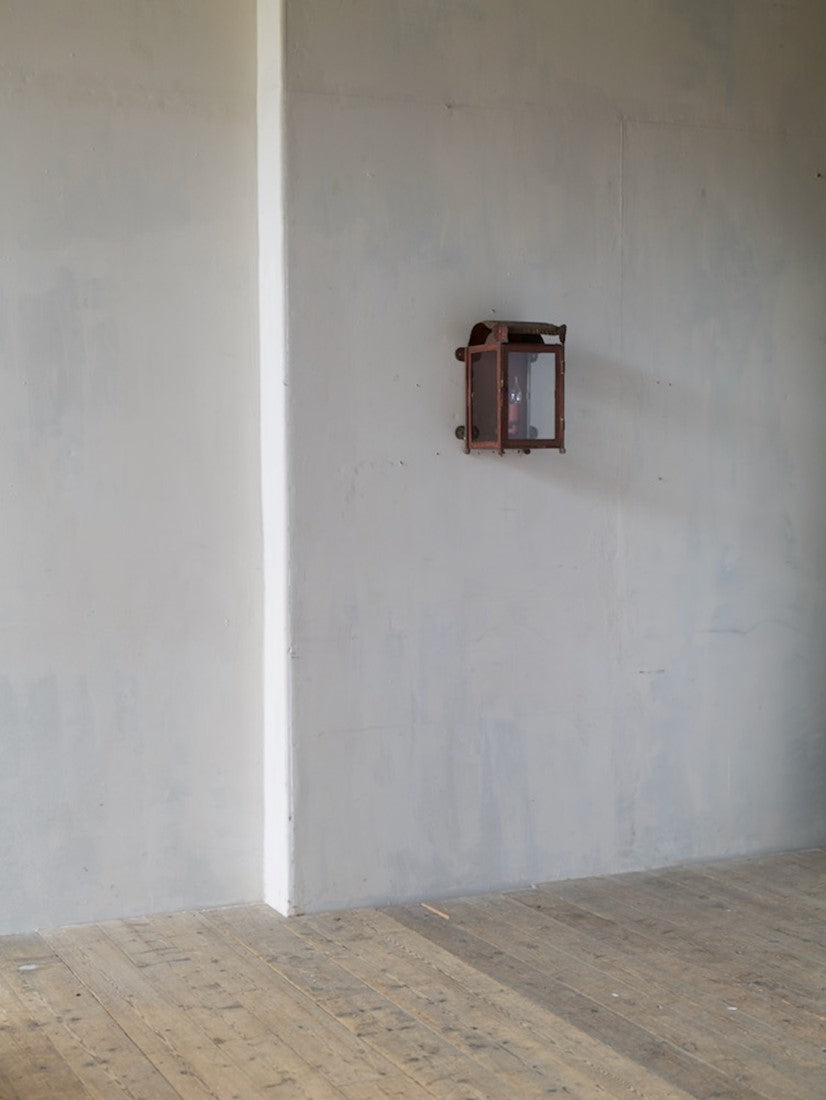 A primitive tole wall lantern