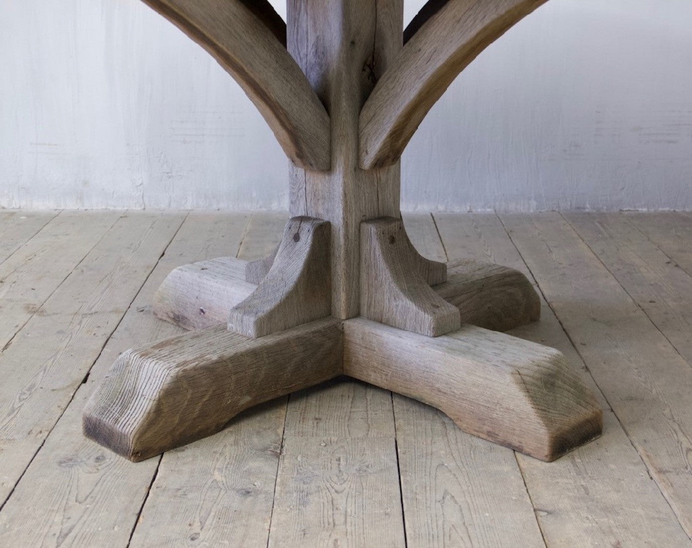 A weathered oak and zinc dining table