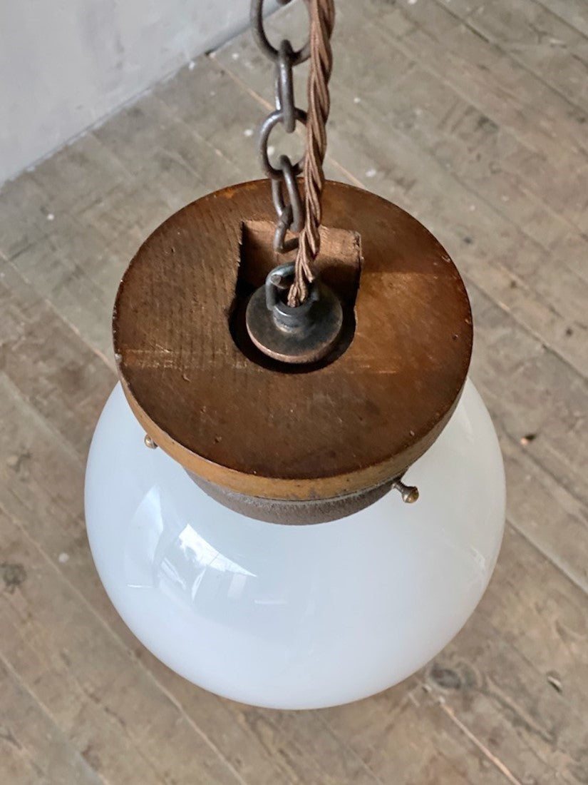 A pair of globe pendant lights