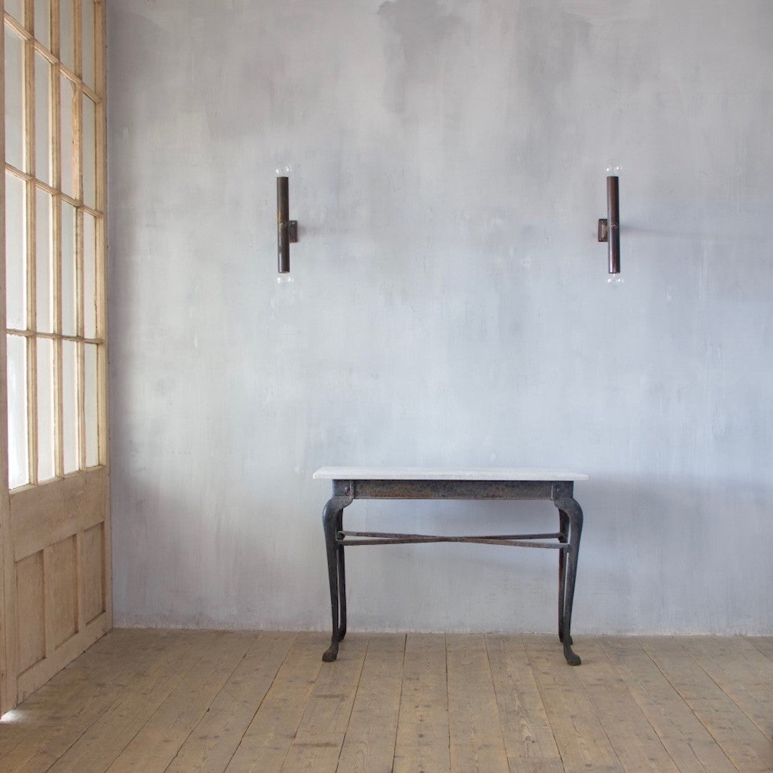 An iron and marble console table
