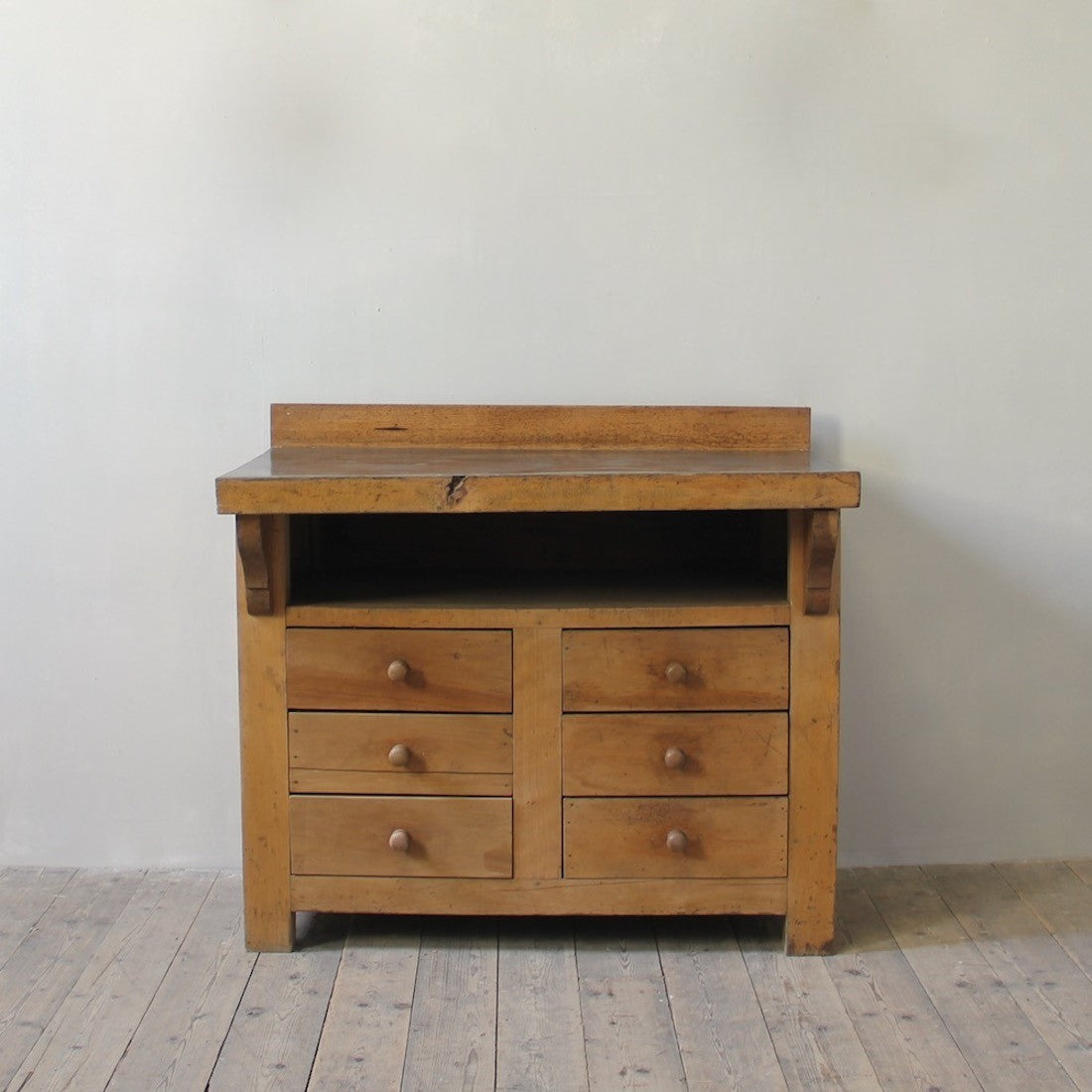 A primitive beech chest of drawers