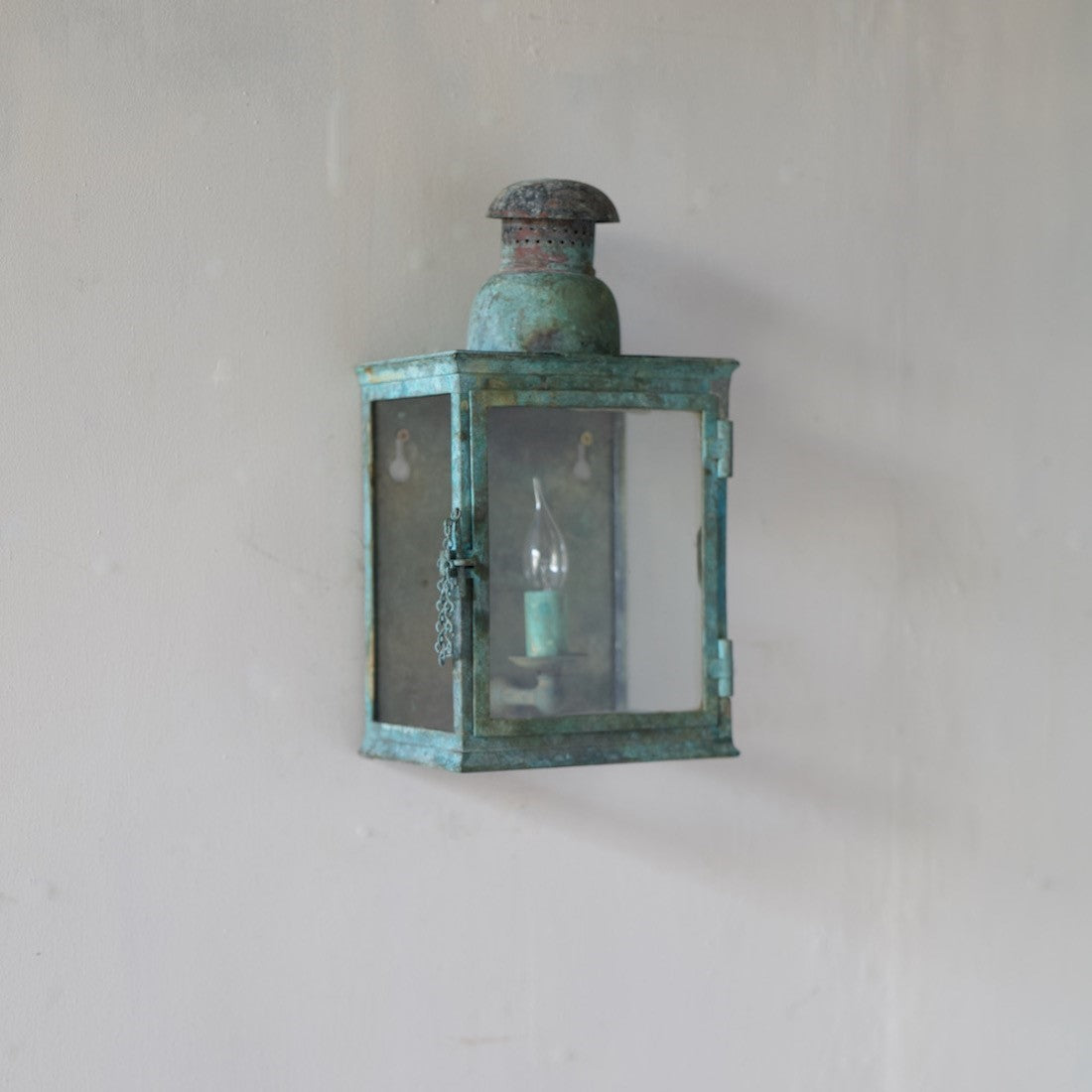 A verdigris bronze wall lantern