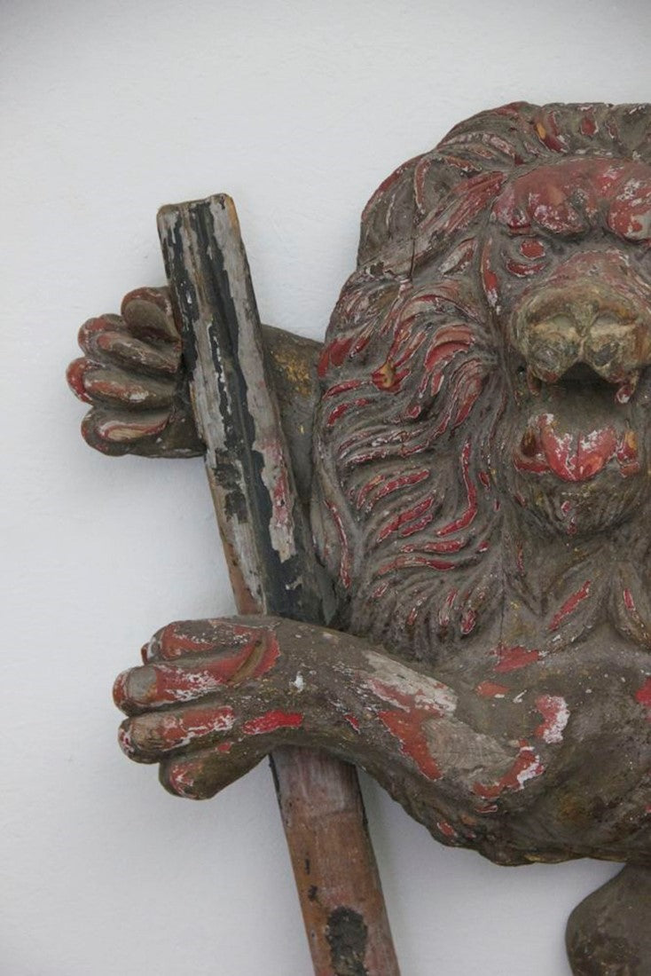 A C19th carved wood lion and anchor