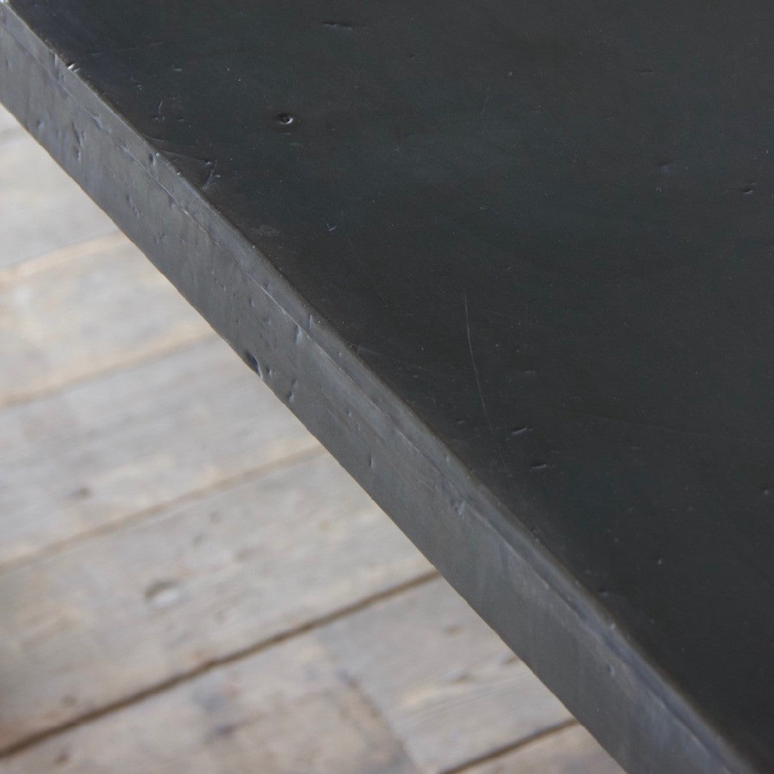 An architectural wrought iron trestle table