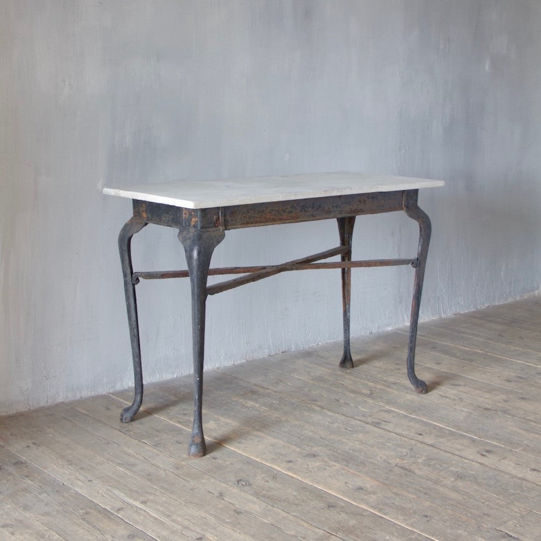 An iron and marble console table