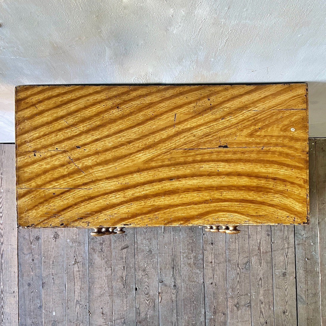 A faux elm painted chest of drawers