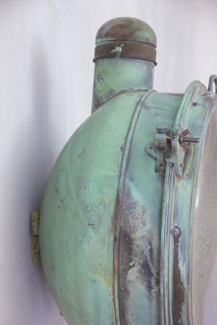A 1920s pair of copper Holophane wall lights