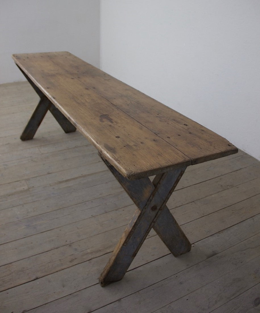An X-frame trestle table