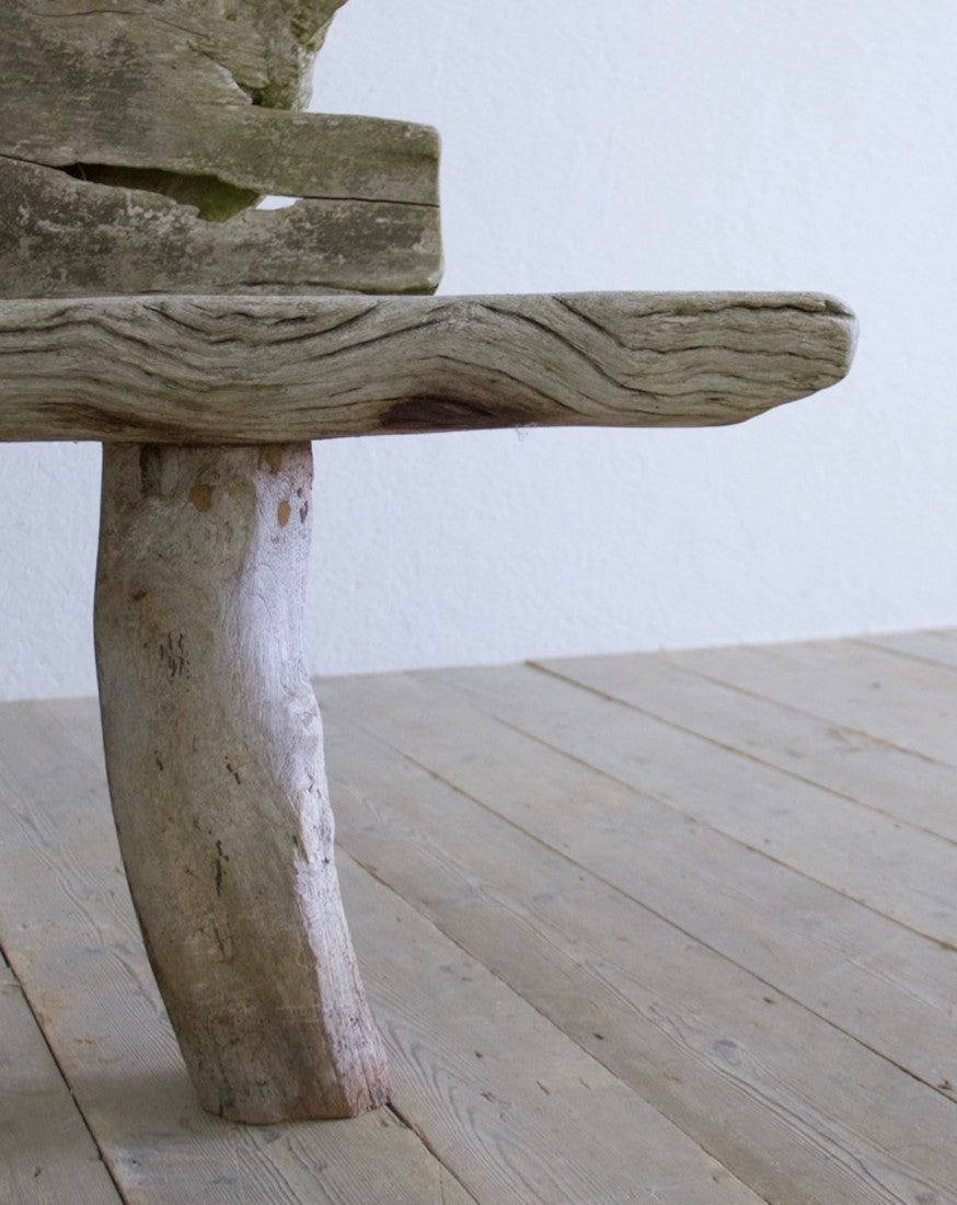 A sculptural 'splash' teak bench