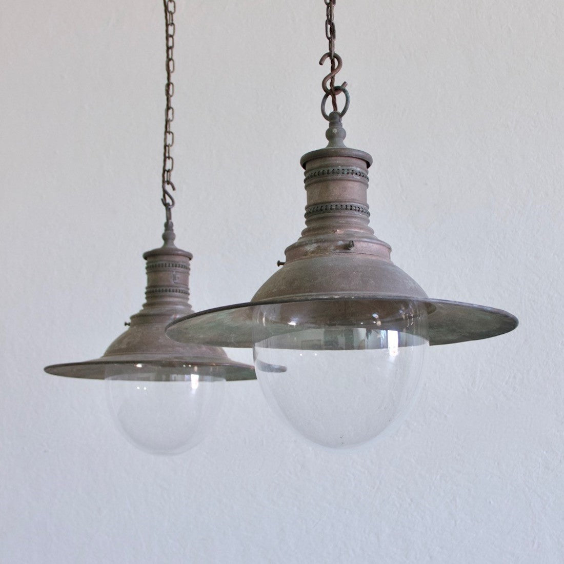 A pair of copper pendant lights