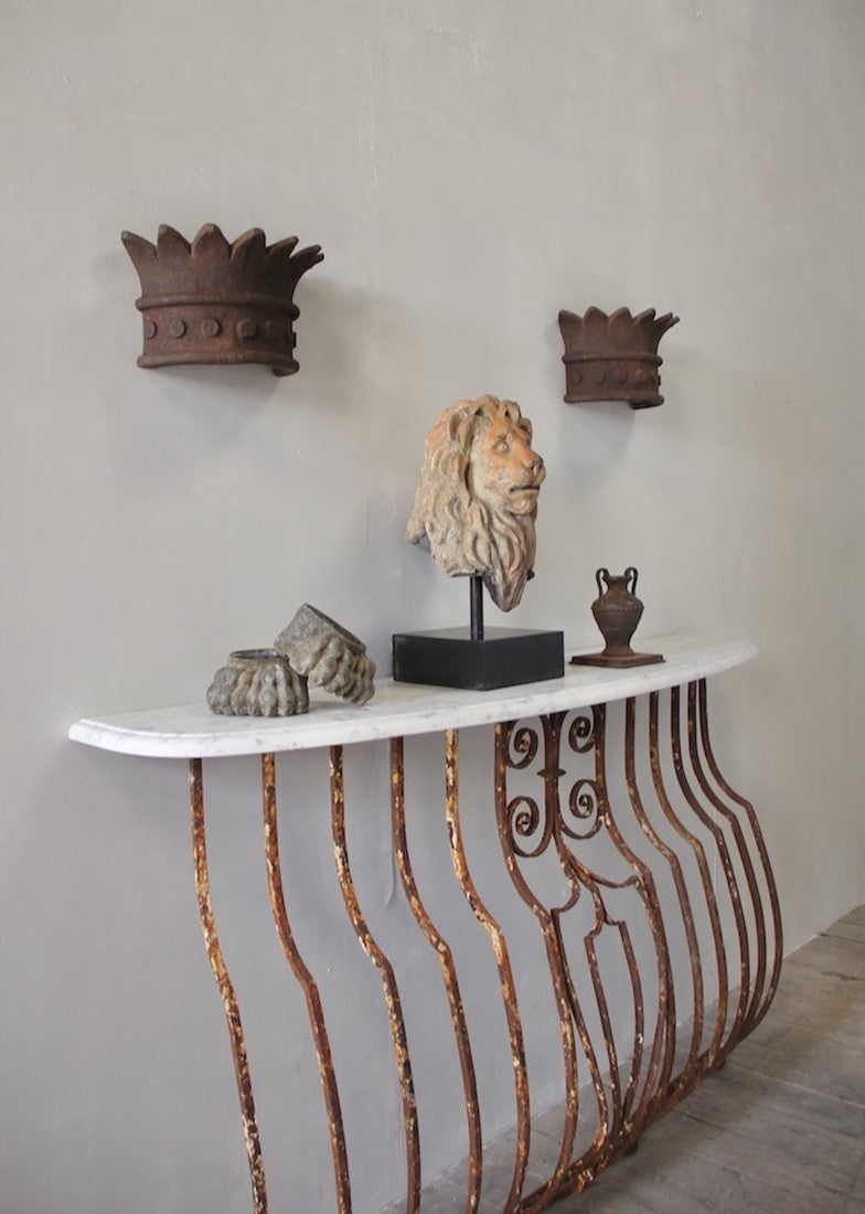 A pair of crown wall lights