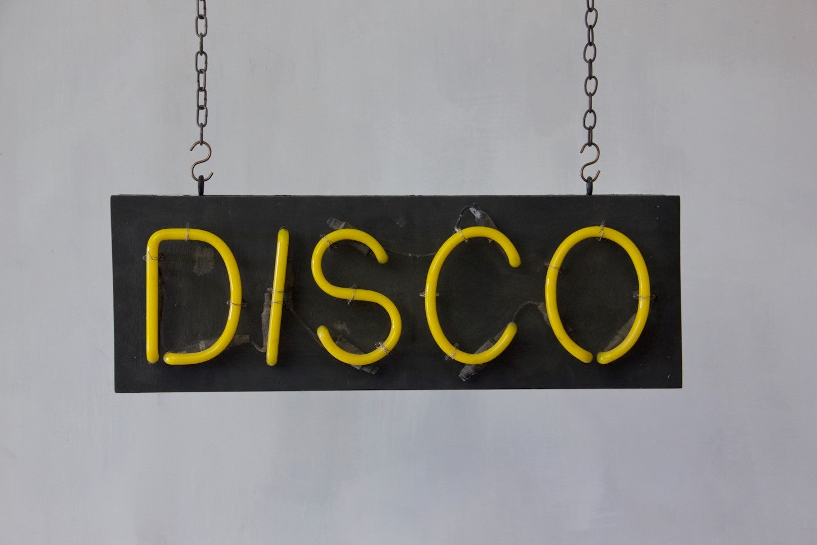 A 1980s neon disco sign