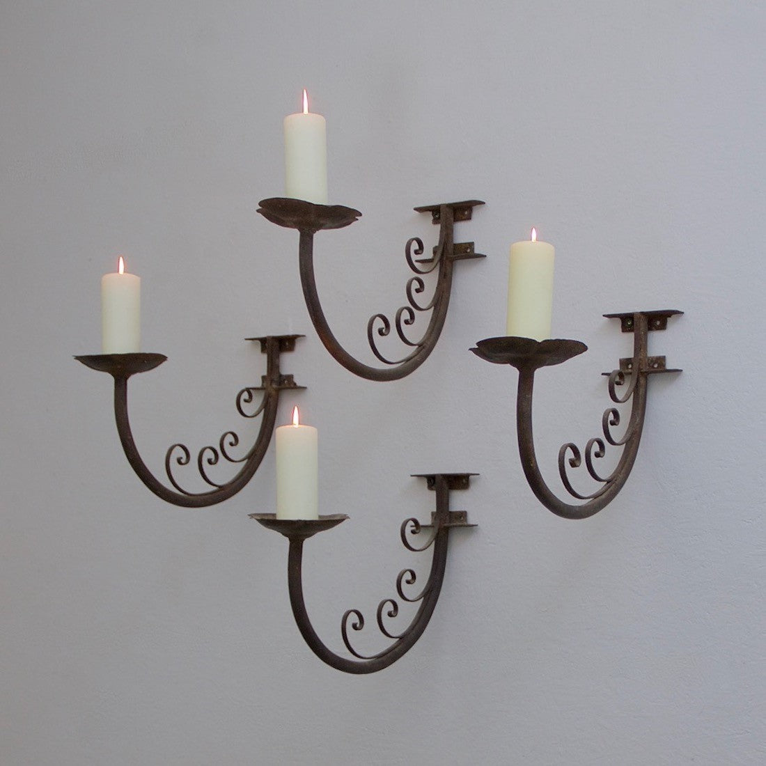 A set of 4 iron wall prickets