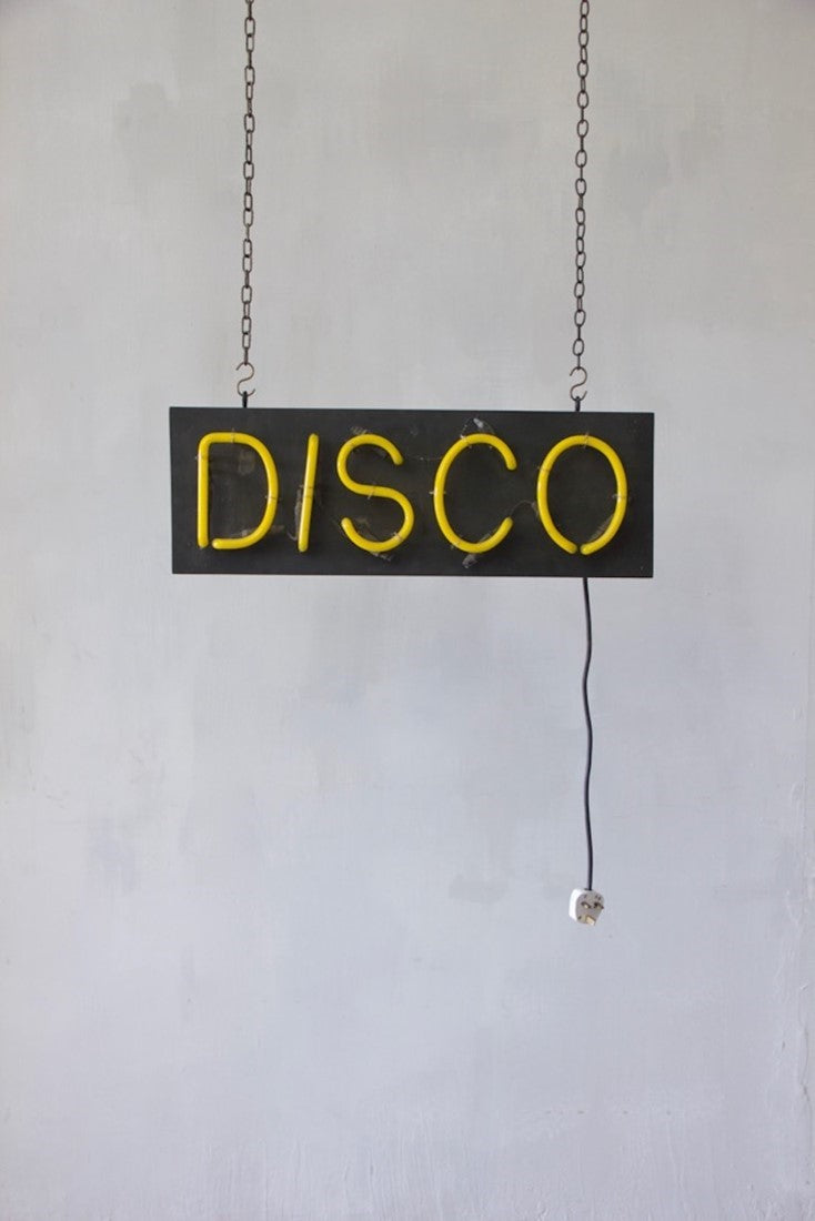 A 1980s neon disco sign