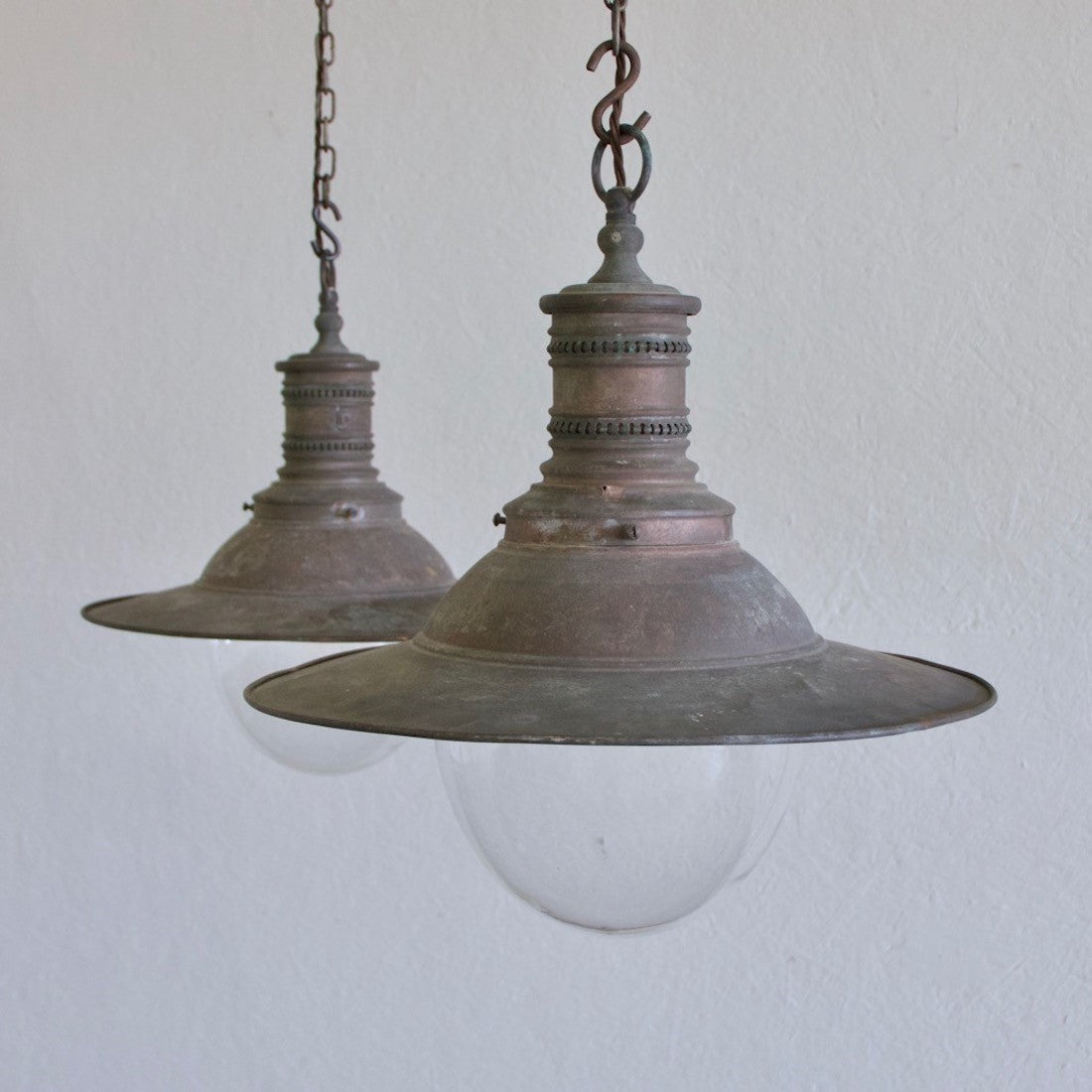 A pair of copper pendant lights