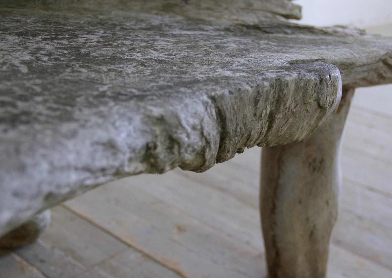 A sculptural 'splash' teak bench