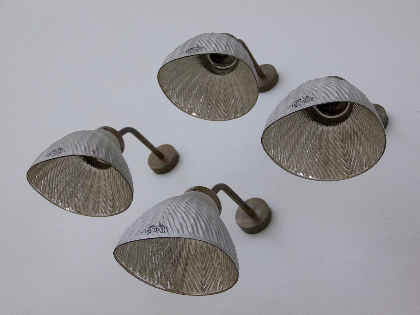 A set of 4 mirrored wall lights