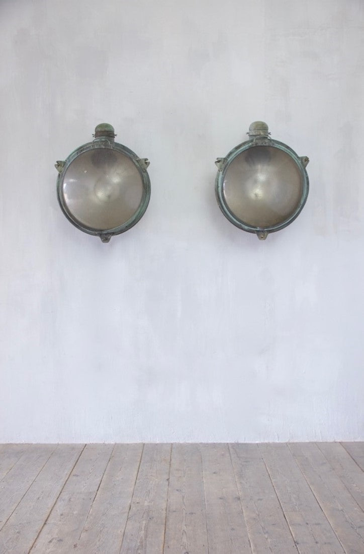 A 1920s pair of copper Holophane wall lights