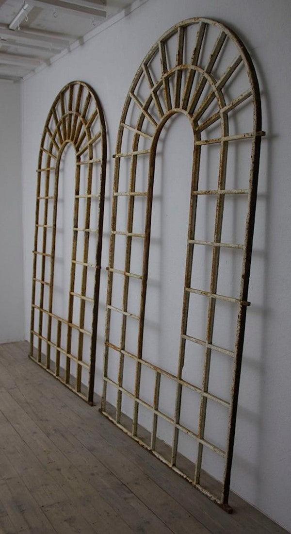 A large pair of C19th arched iron frames