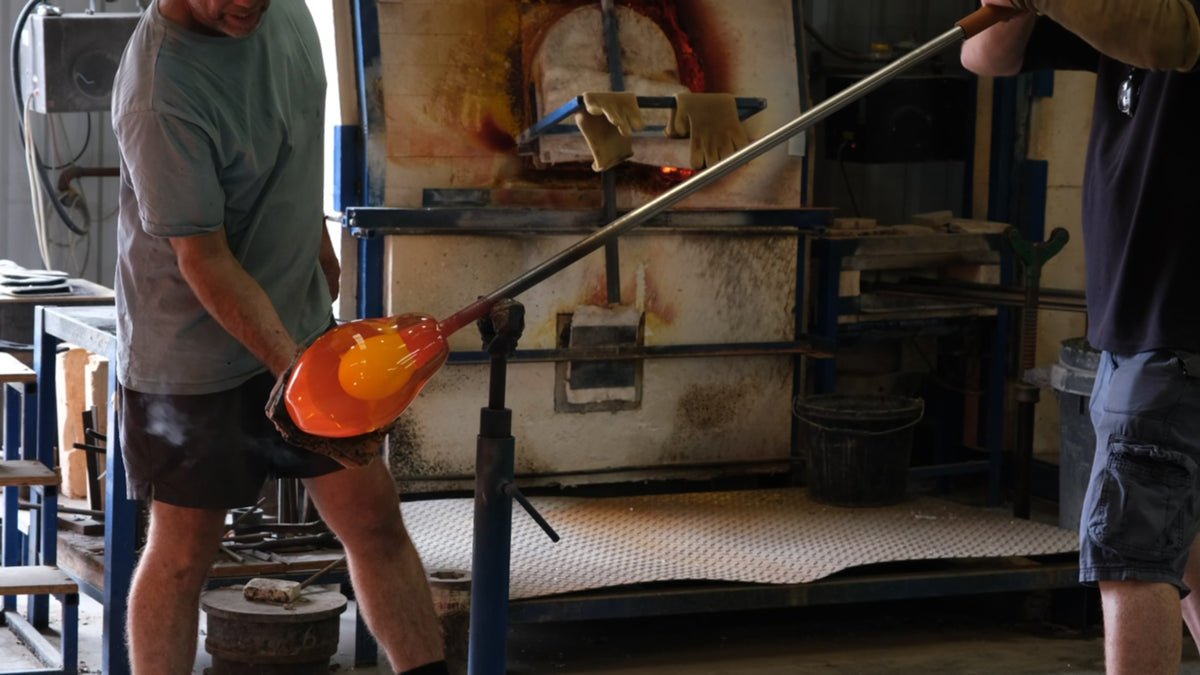 The blowing of the glass shades for our corolla and domus lanterns